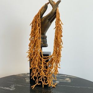 Coral-like fringe bib necklace.